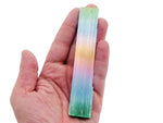 Rainbow Aura Selenite wand gemstone in natural raw form, 4-12cm, with vibrant rainbow hues and crystalline structure.