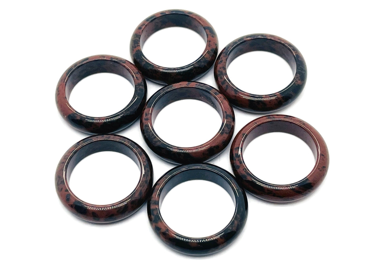 Mahogany Obsidian crystal ring by GemstoneGO featuring a polished gemstone set in a silver band.