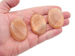 Orange aventurine worry stone by GemstoneGO, 4.5x3.5cm, smooth soothing crystal for stress relief and meditation.
