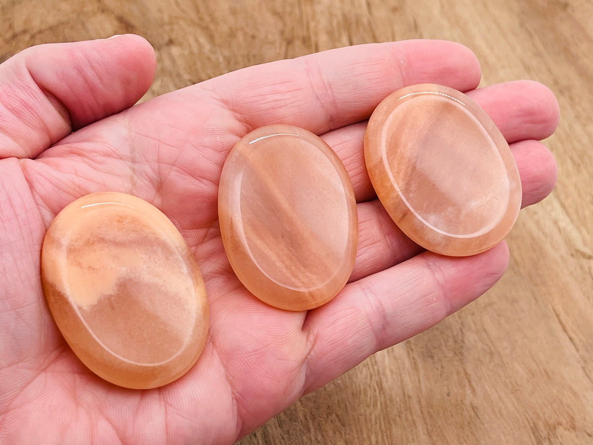 Orange aventurine worry stone from GemstoneGO, 4.5x3.5cm, smooth polished crystal for stress relief and calming.