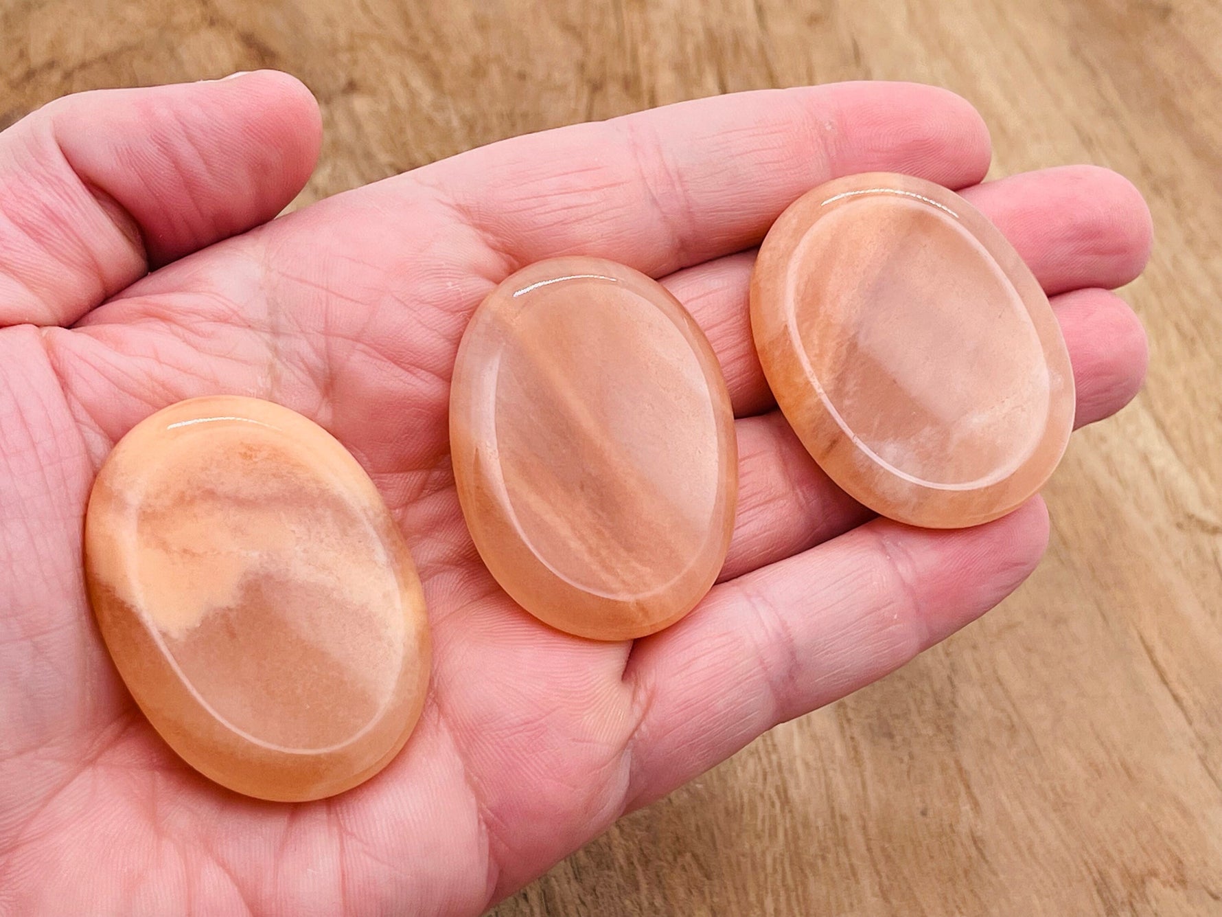 Orange aventurine worry stone from GemstoneGO, 4.5x3.5cm, smooth polished crystal for stress relief and calming.