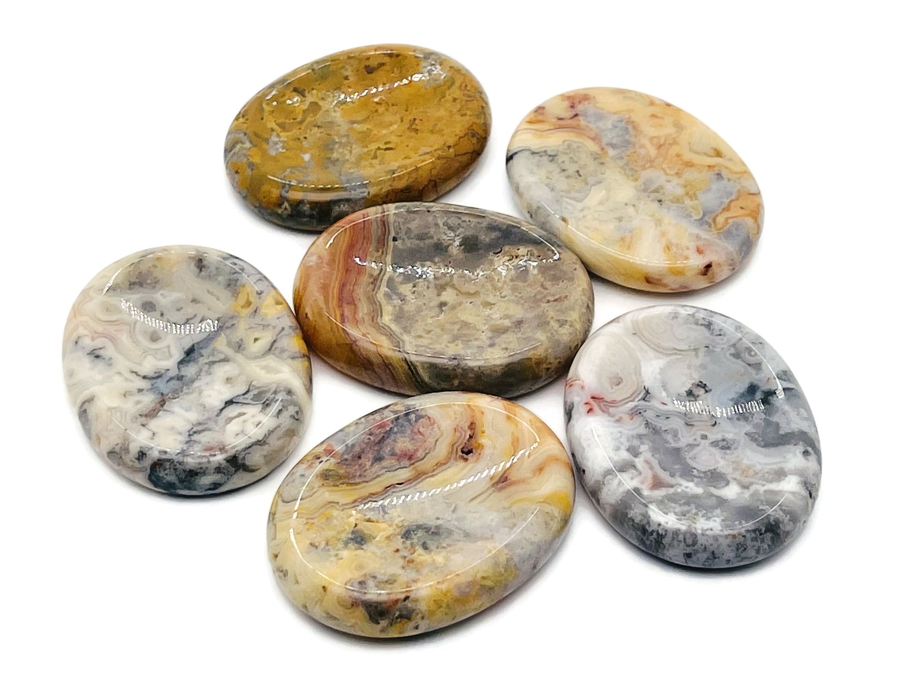 Crazy Lace Agate worry stone from GemstoneGO, 4.5x3.5cm, featuring vibrant, intricate lace-like patterns in polished crystal.