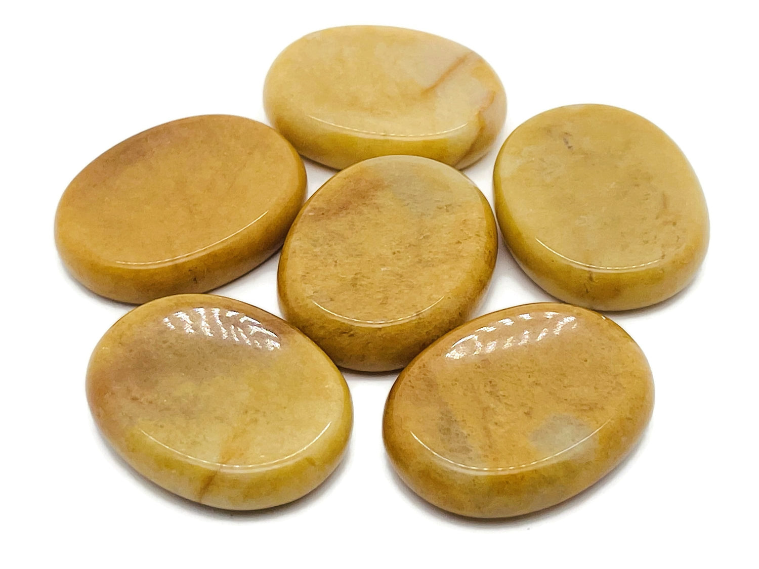 Yellow Jade worry stone from GemstoneGO, soothing crystal with smooth surface, measuring 4.5x3.5cm, ideal for stress relief and meditation.