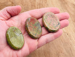 Unakite worry stone from GemstoneGO, 4.5x3.5cm, featuring smooth, polished pink and green crystal for soothing stress relief.