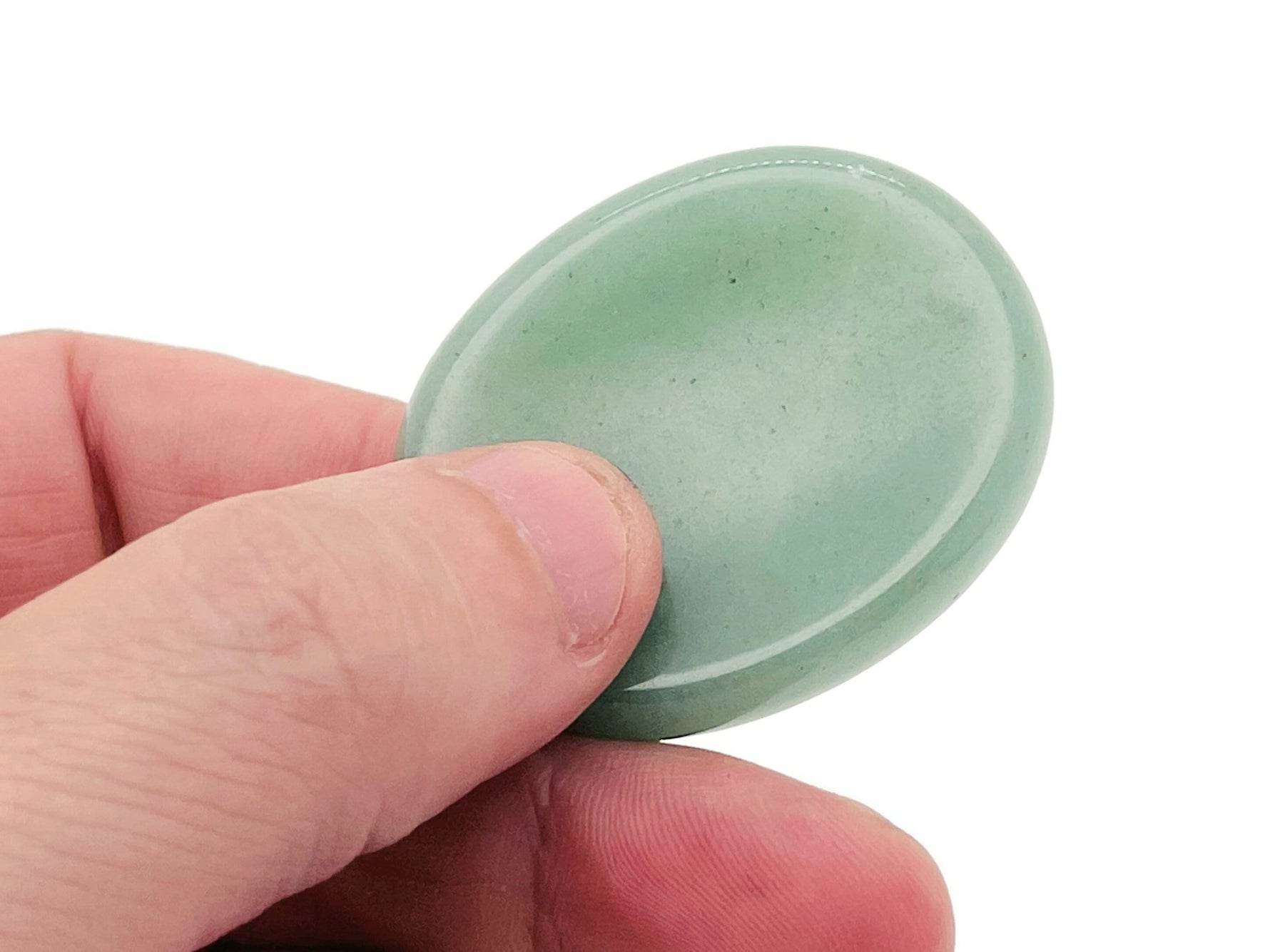 Aventurine worry stone from GemstoneGO, smooth 4.5x3.5cm crystal with polished surface, used for calming and stress relief.