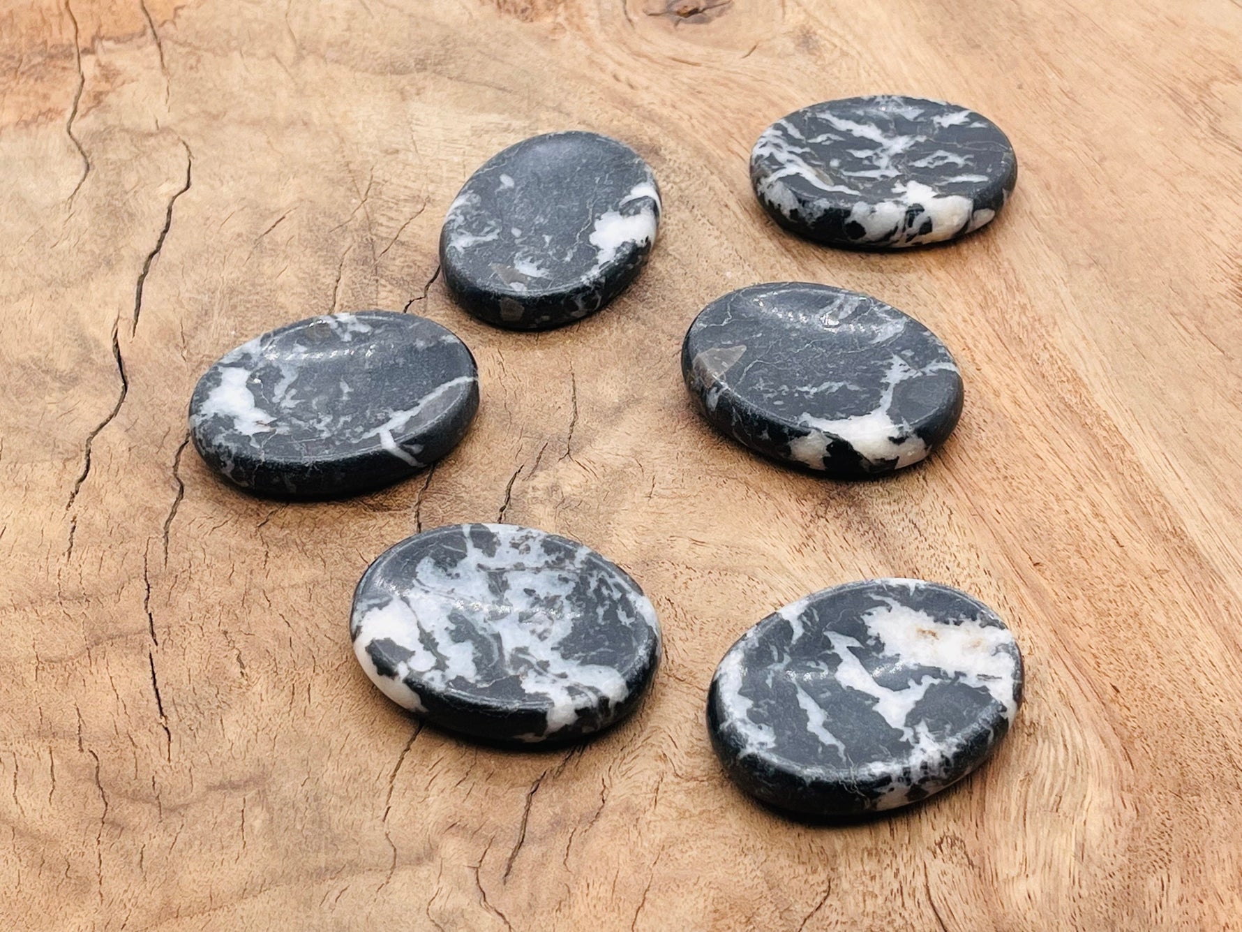 Zebra Calcite worry stone from GemstoneGO, smooth 4.5x3.5cm calming crystal for stress relief and meditation.