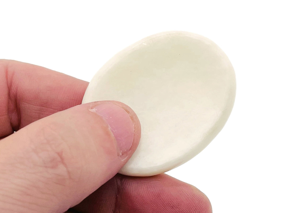 White jade worry stone from GemstoneGO, 4.5x3.5cm, smooth polished crystal for stress relief and calming purposes.
