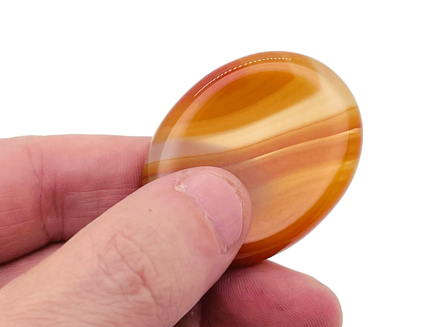 Carnelian worry stone from GemstoneGO, a 4.5x3.5cm soothing crystal for stress relief and meditation.