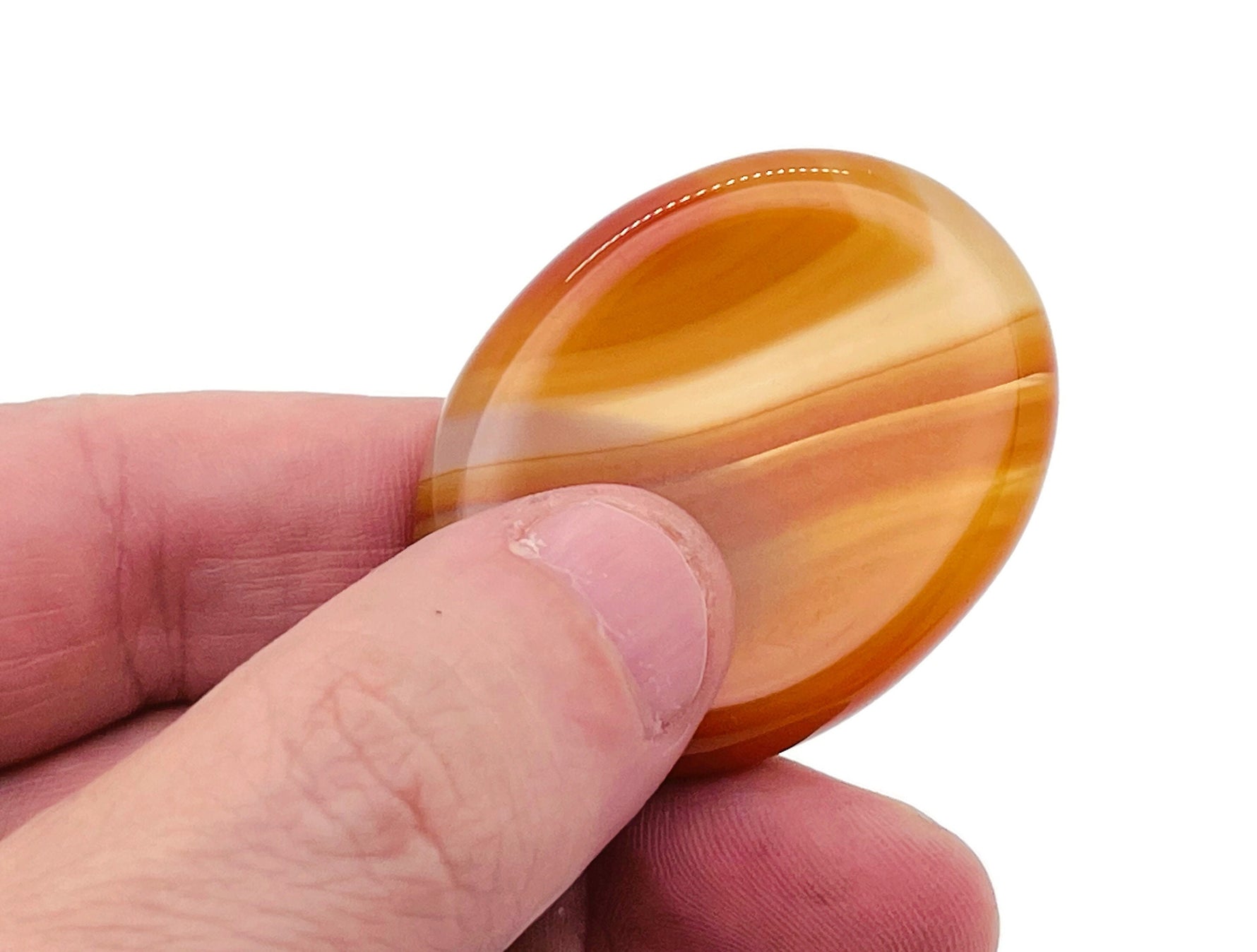 Carnelian worry stone from GemstoneGO, a 4.5x3.5cm soothing crystal for stress relief and meditation.