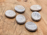 Fossil coral worry stone from GemstoneGO, 4.5x3.5cm soothing crystal with fossilized coral pattern, smooth and polished surface.