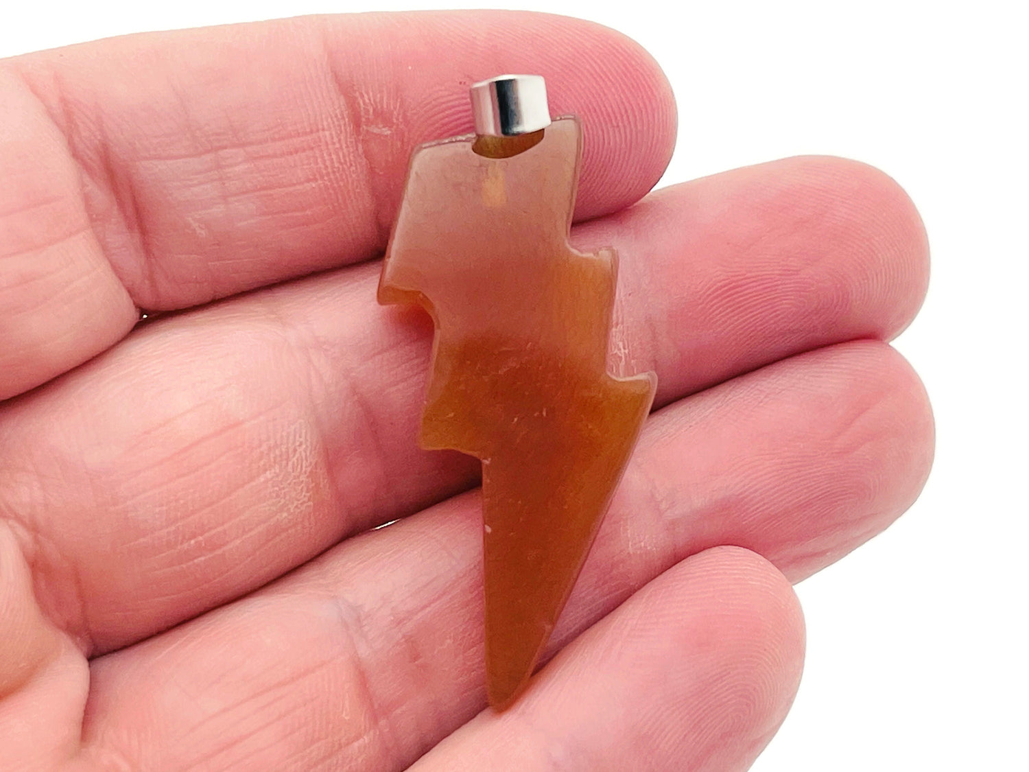 Carnelian Lightning Crystal pendant featuring vibrant orange lightning stone on a silver chain, crafted by GemstoneGO.