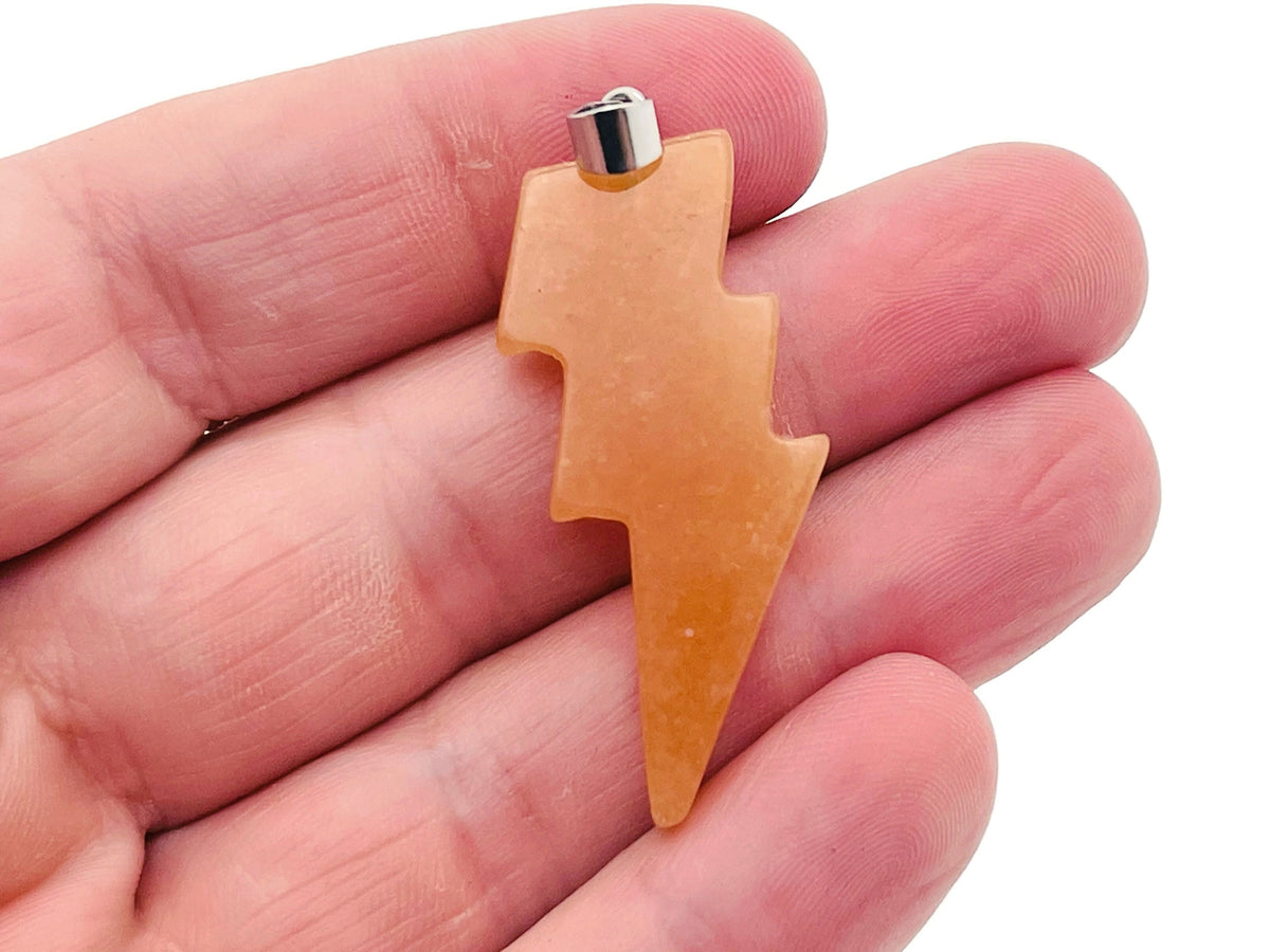 Orange aventurine lightning crystal pendant with a lightning stone design from GemstoneGO, showcasing a polished orange gemstone pendant.