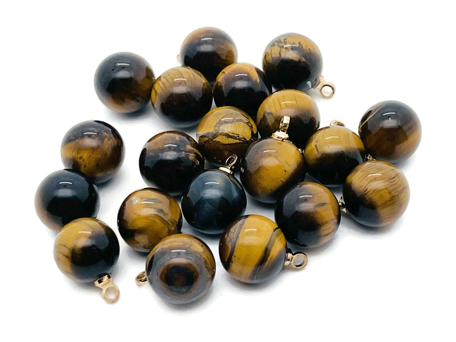 Tiger Eye crystal pendant with round beads, showcasing warm, chatoyant gemstone jewelry from GemstoneGO.