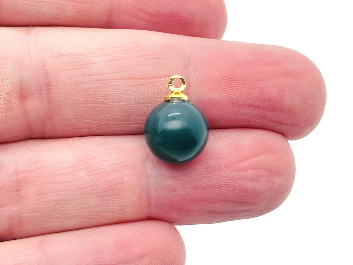 Moss agate ball beads with crystal pendant, showcasing natural stone jewelry from GemstoneGO.