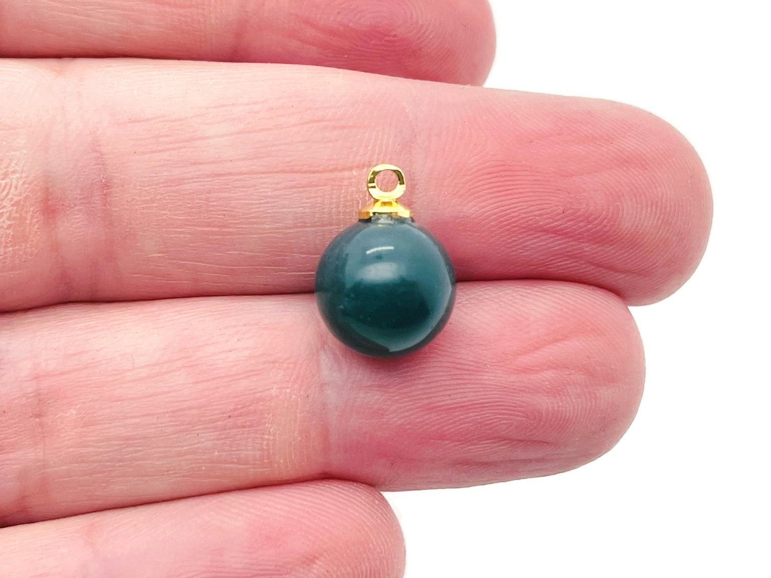 Moss agate ball beads with crystal pendant, showcasing natural stone jewelry from GemstoneGO.