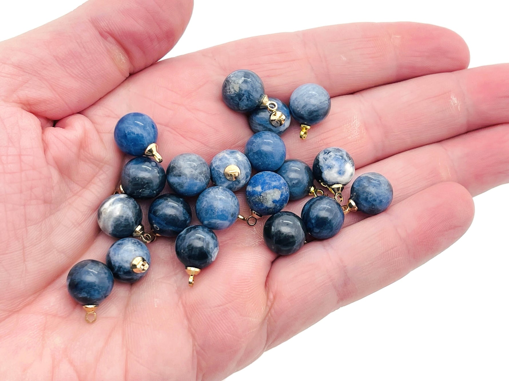 Sodalite ball beads crystal pendant from GemstoneGO, showcasing vibrant blue and white gemstone jewelry stone with natural patterning.