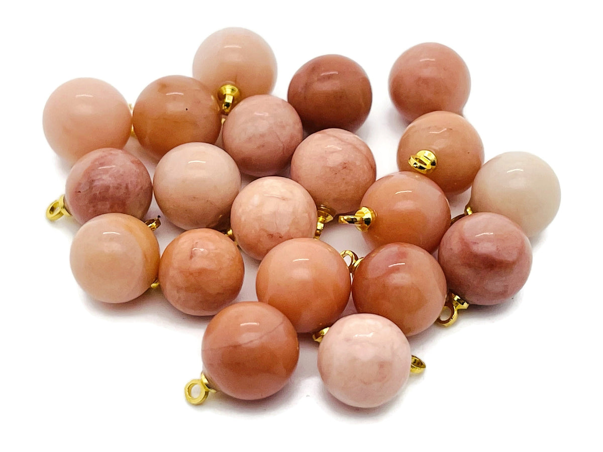 Orange aventurine ball beads crystal pendant with silver bail, showcasing vibrant orange gemstone jewelry stone.