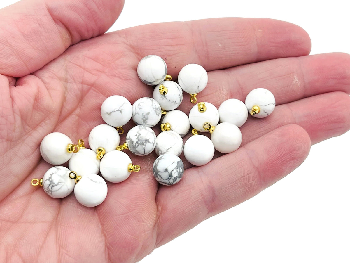 Howlite ball beads with crystal pendant jewelry featuring smooth white stones and silver accents, perfect for elegant gemstone jewelry.