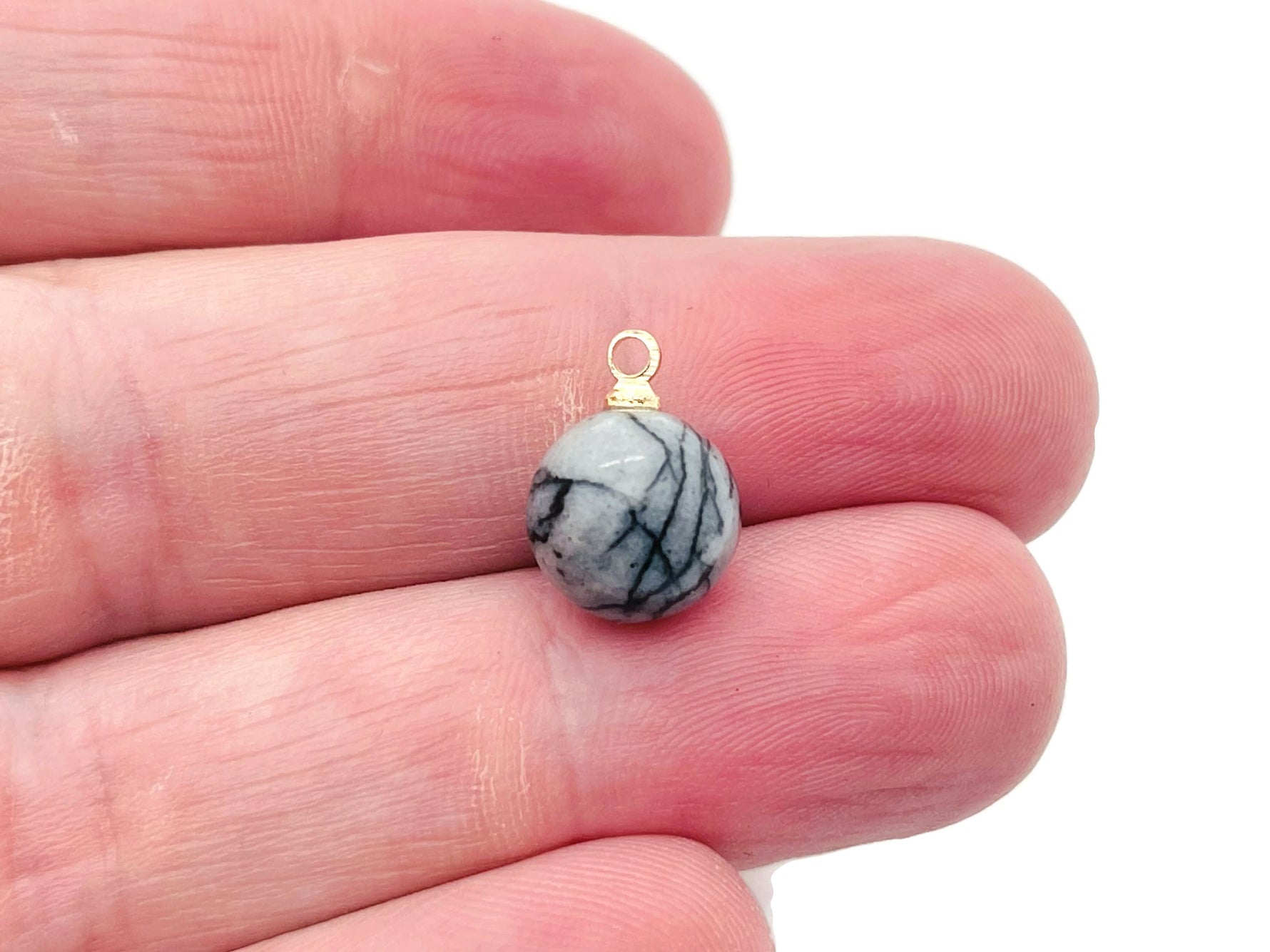 Black Network Jasper ball beads with crystal pendant, handcrafted gemstone jewelry featuring natural stone and intricate design.