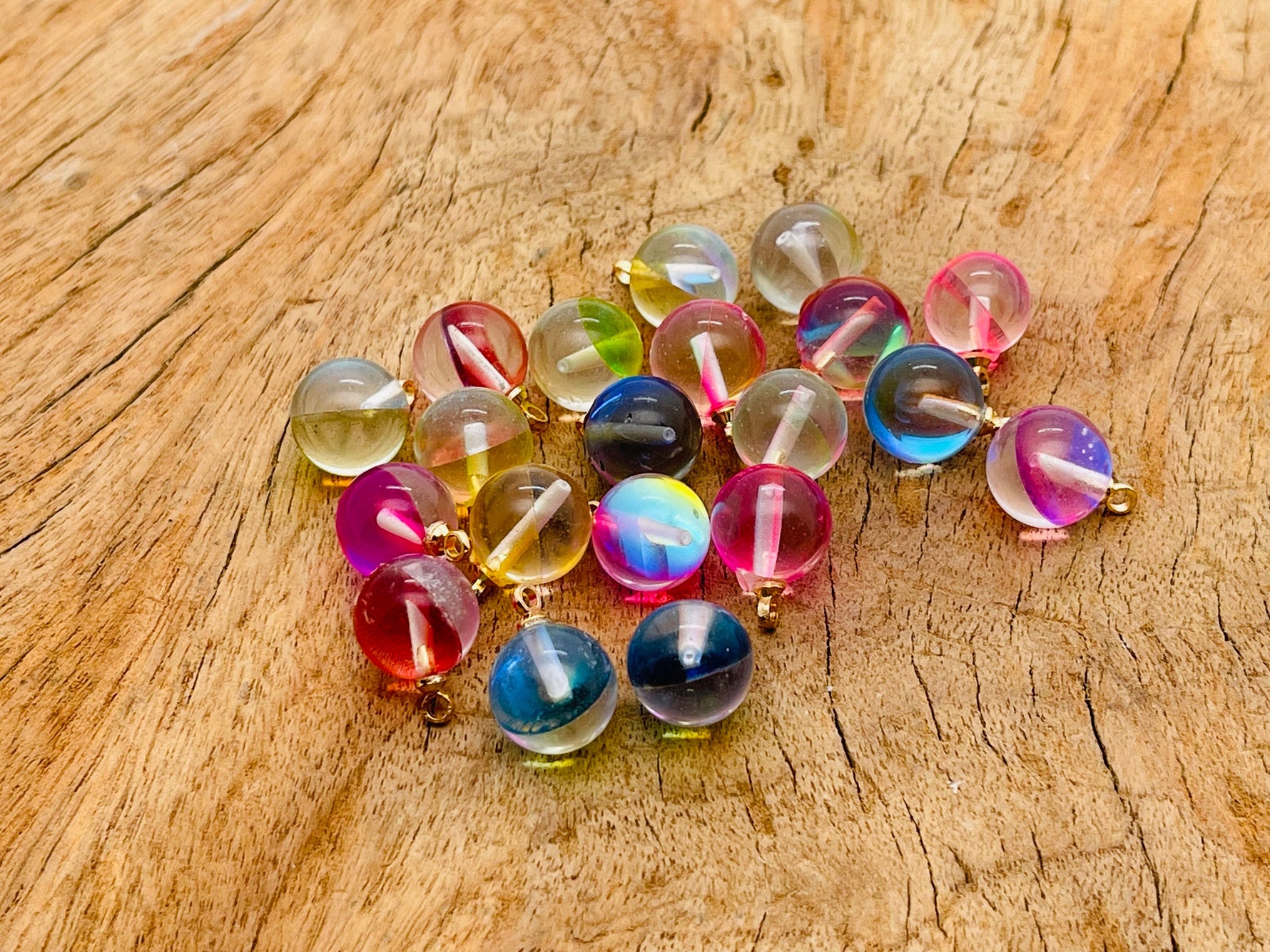 Angel Aura ball beads crystal pendant from GemstoneGO featuring a luminous, iridescent jewelry stone with a round shape and vibrant shimmer.