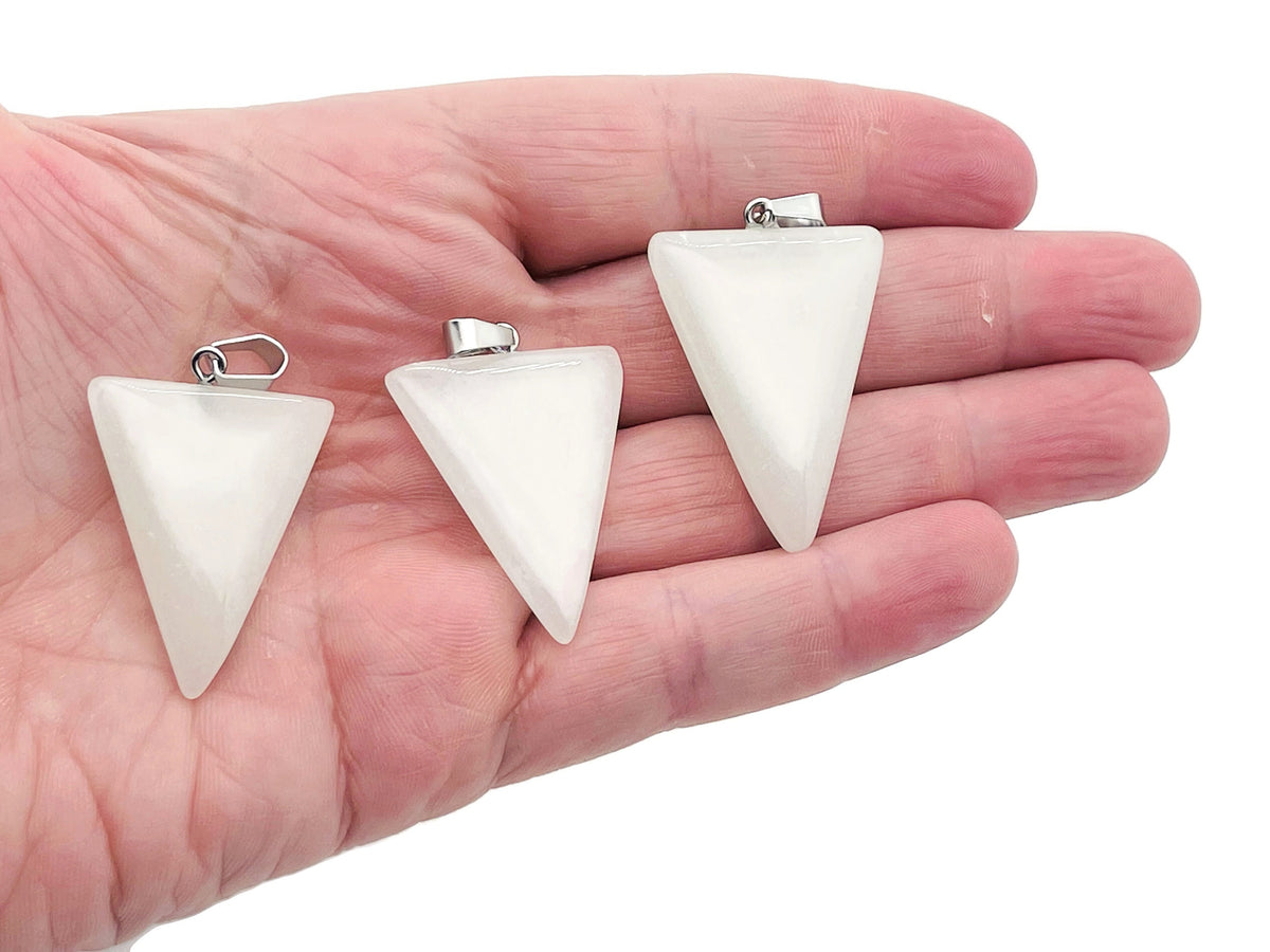 Luminous triangle crystal pendant with healing stone from GemstoneGO, showcasing a glowing, faceted gemstone pendant on a chain.