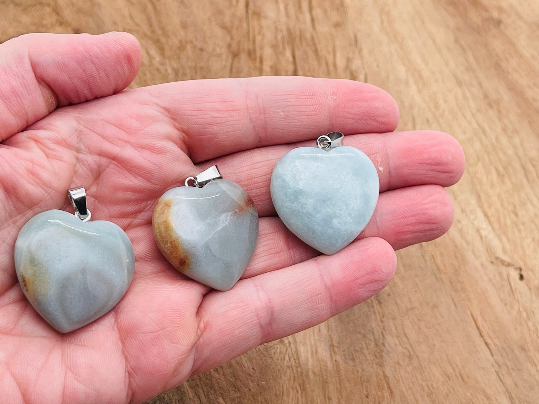 Amazonite heart crystal pendant from GemstoneGO, featuring a natural Reiki healing gemstone with detailed craftsmanship.