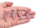 Strawberry Quartz Lightning Crystal Pendant from GemstoneGO featuring a vibrant pink quartz stone with lightning bolt design.