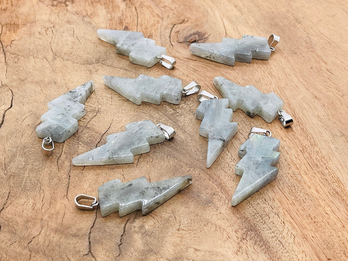 Labradorite Lightning Crystal pendant featuring a striking lightning stone set in a silver-tone metal, showcasing vibrant iridescence.