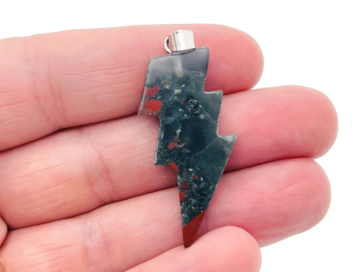 African Bloodstone Lightning Crystal pendant from GemstoneGO featuring a striking lightning-shaped bloodstone crystal on a silver chain.