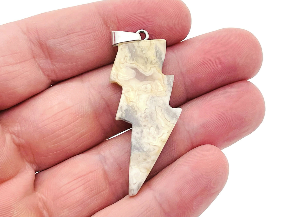 Crazy Lace Agate lightning crystal pendant featuring vibrant lightning stone with intricate patterns, crafted by GemstoneGO.
