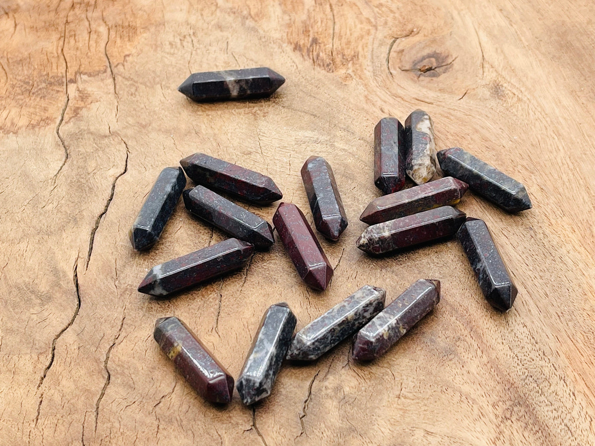 Dragon Blood Jasper carved terminated point, 33mm, from GemstoneGO, showcasing vibrant red and black mineral patterns.