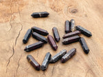 Dragon Blood Jasper carved terminated point, 33mm, from GemstoneGO, showcasing vibrant red and black mineral patterns.