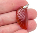 Carnelian angel wing crystal pendant with hole charm from GemstoneGO, showcasing vibrant orange stone and detailed wing design.