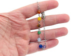 Crystal chakra bracelet with seven colorful stones from GemstoneGO, featuring a stylish and spiritual design.