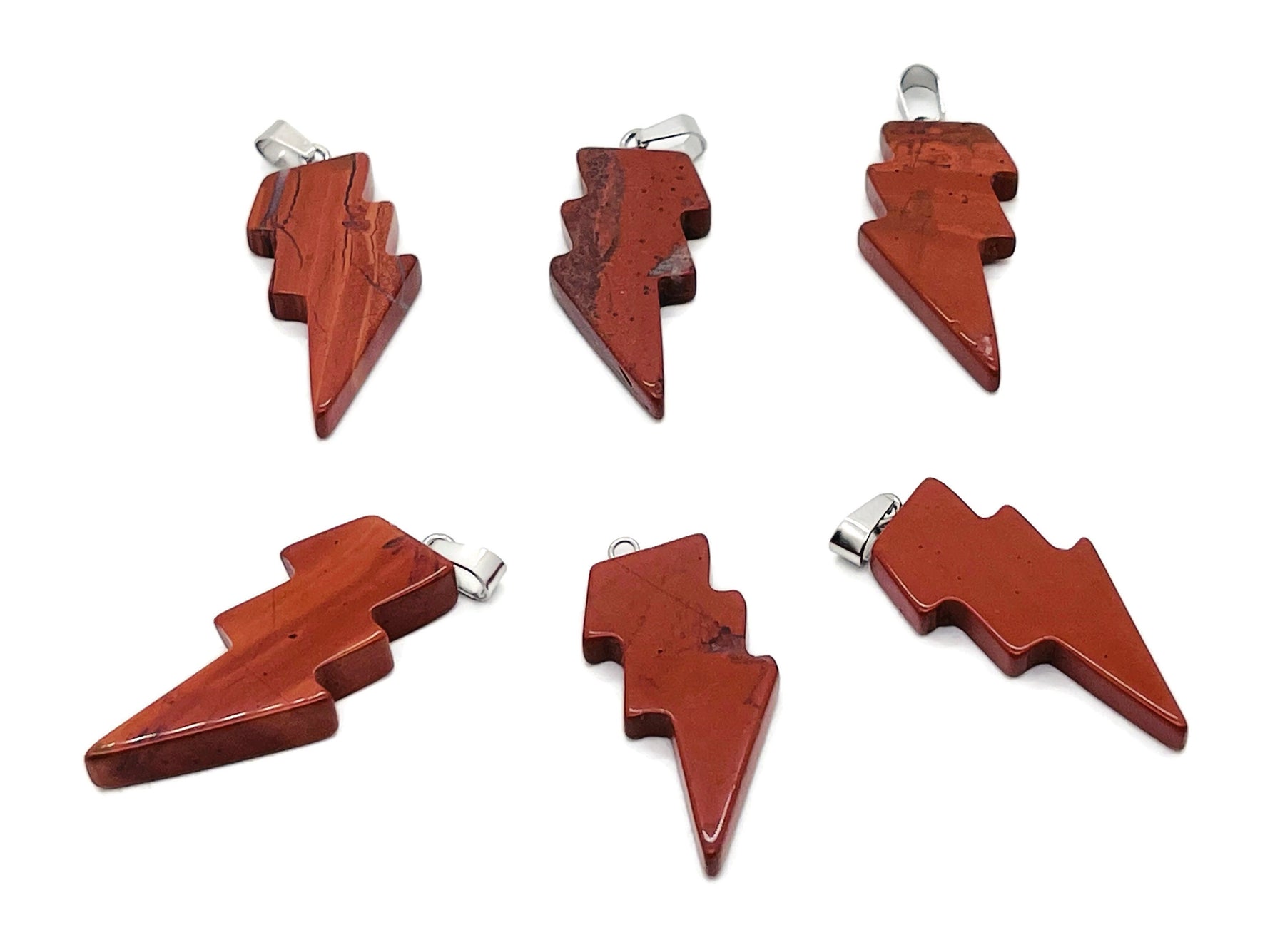 Red Jasper Lightning Crystal pendant featuring a striking lightning stone design from GemstoneGO, showcasing a vibrant red gemstone.
