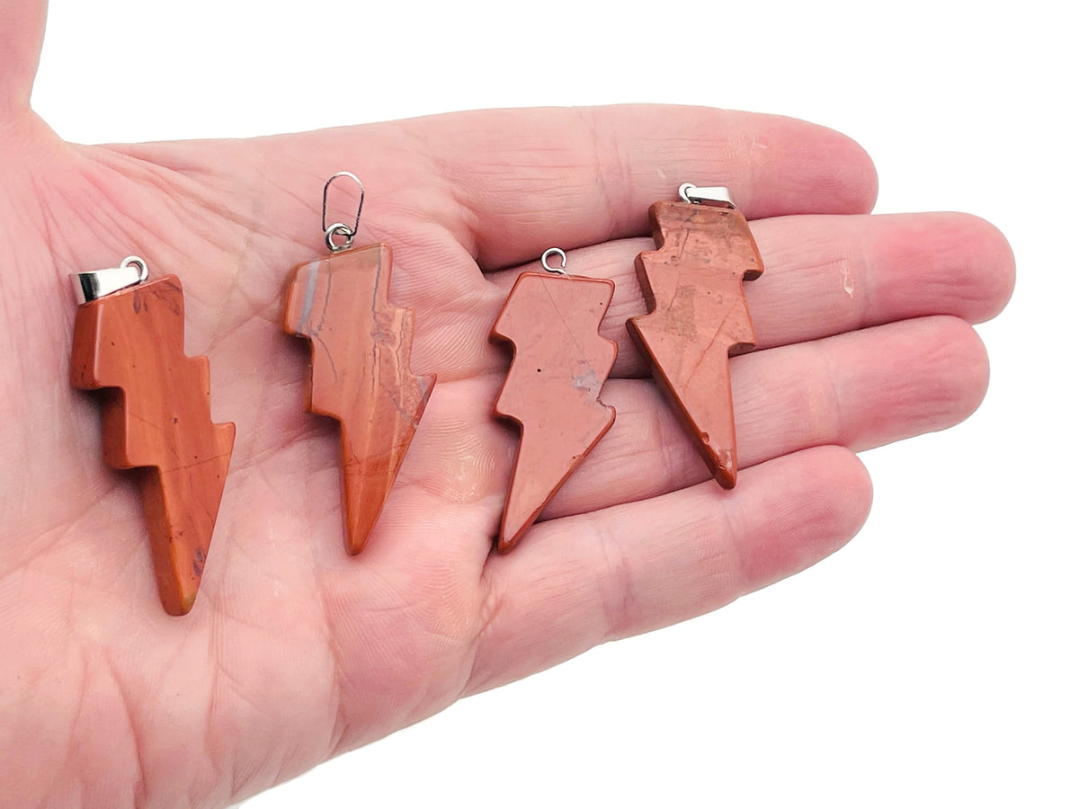 Red Jasper Lightning Crystal Pendant from GemstoneGO featuring a striking lightning-shaped red jasper stone necklace.