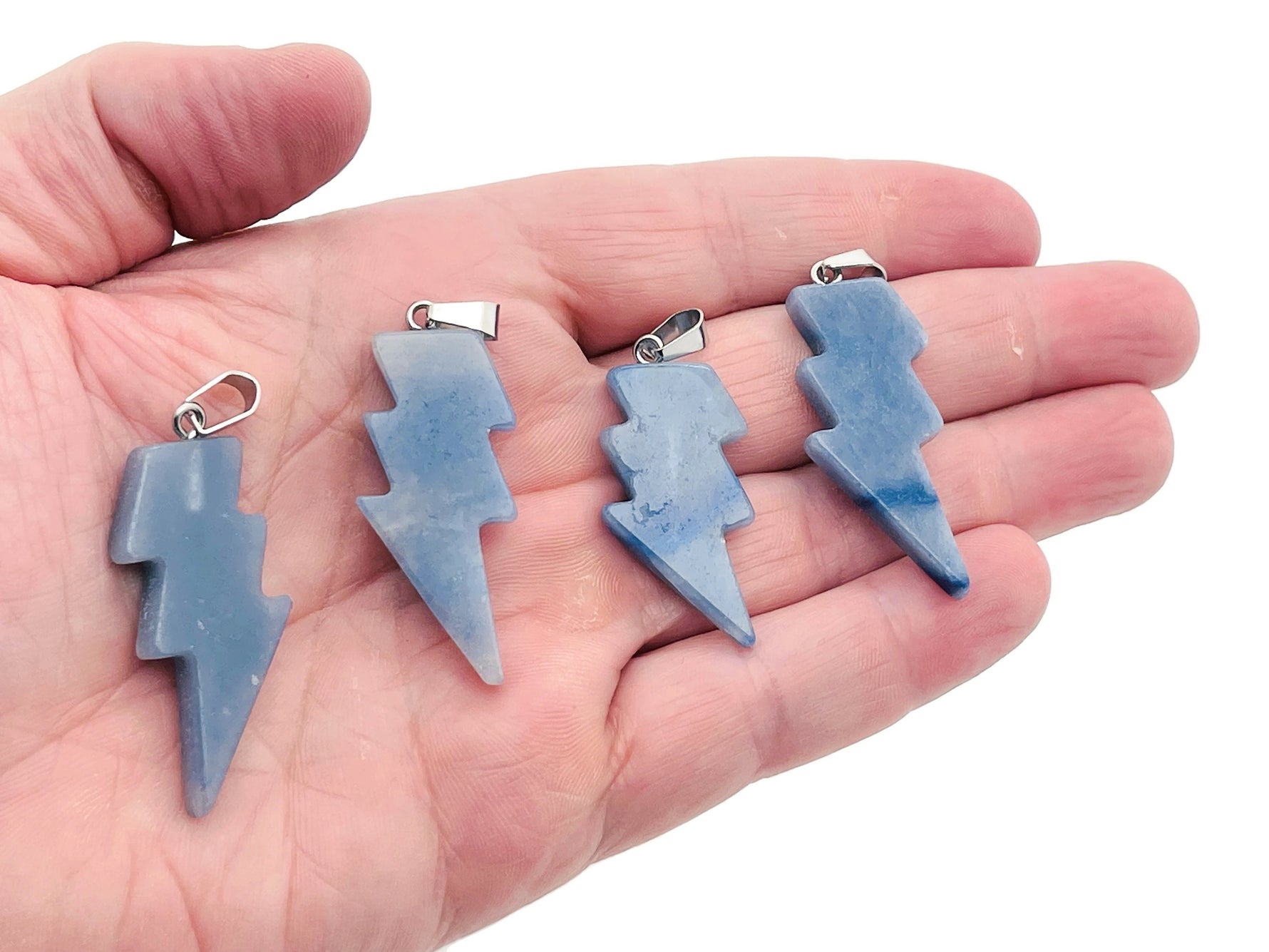 Blue aventurine lightning crystal pendant from GemstoneGO featuring a striking lightning stone design against a neutral background.