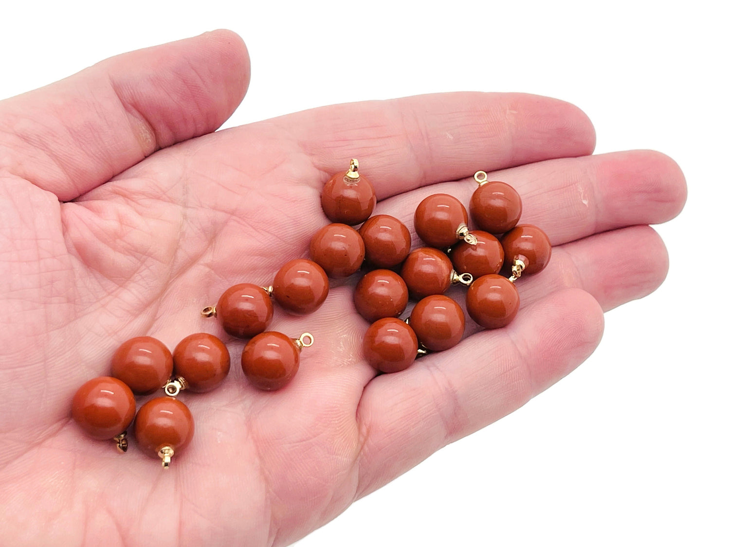 Red Jasper ball bead crystal pendant from GemstoneGO, showcasing a polished red gemstone pendant with a silver bail for jewelry.