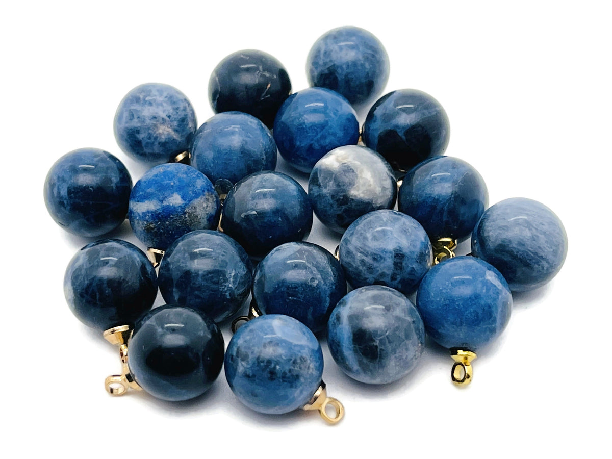 Sodalite ball beads crystal pendant from GemstoneGO, showcasing polished blue and white stone jewelry with silver accents.