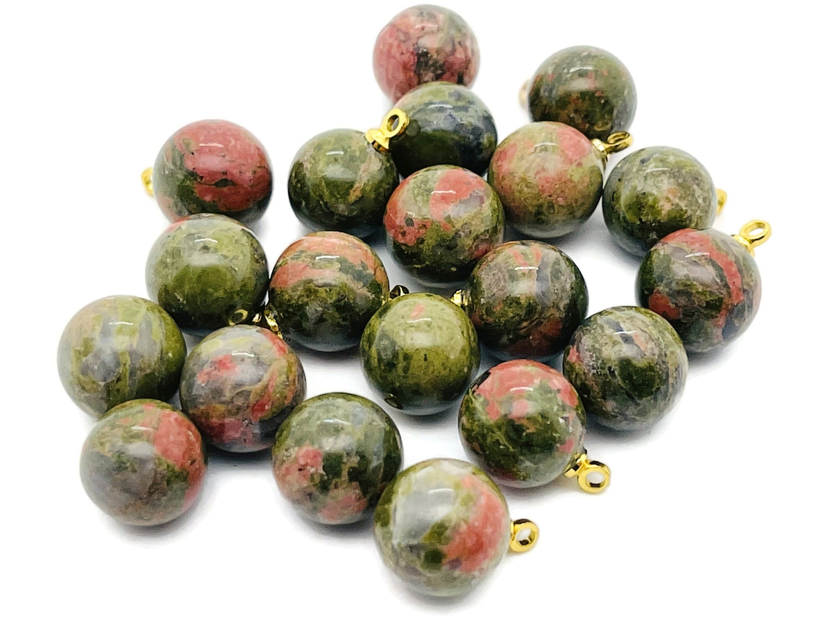 Unakite ball beads with crystal pendant jewelry from GemstoneGO, showcasing polished green and pink gemstone stones.