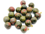 Unakite ball beads with crystal pendant jewelry from GemstoneGO, showcasing polished green and pink gemstone stones.