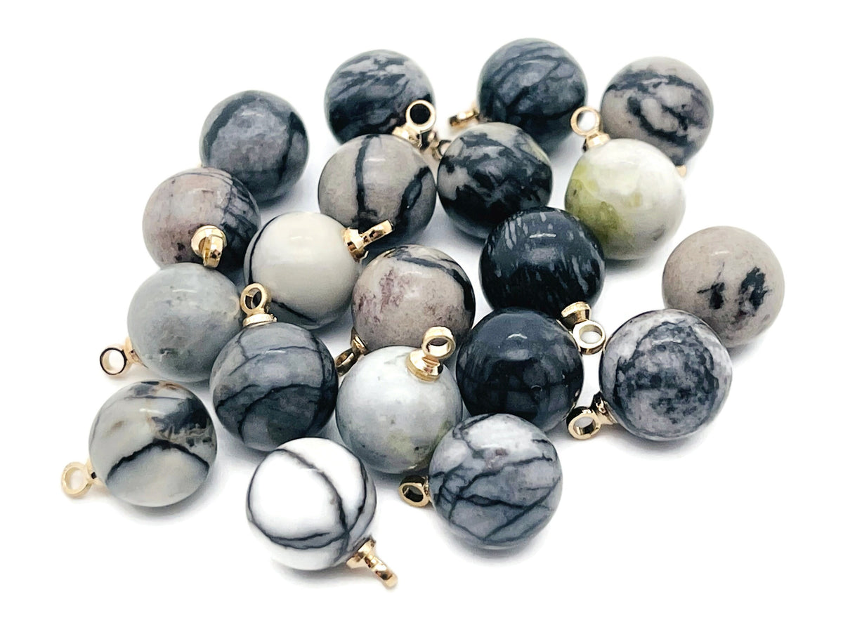 Black Network Jasper ball beads with crystal pendant, showcasing polished gemstone jewelry from GemstoneGO.