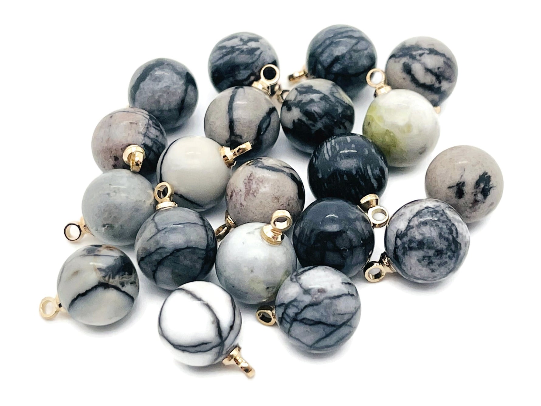 Black Network Jasper ball beads with crystal pendant, showcasing polished gemstone jewelry from GemstoneGO.