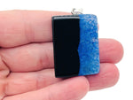 Blue with black agate crystal pendant featuring a polished agate charm, hanging from a delicate silver chain.
