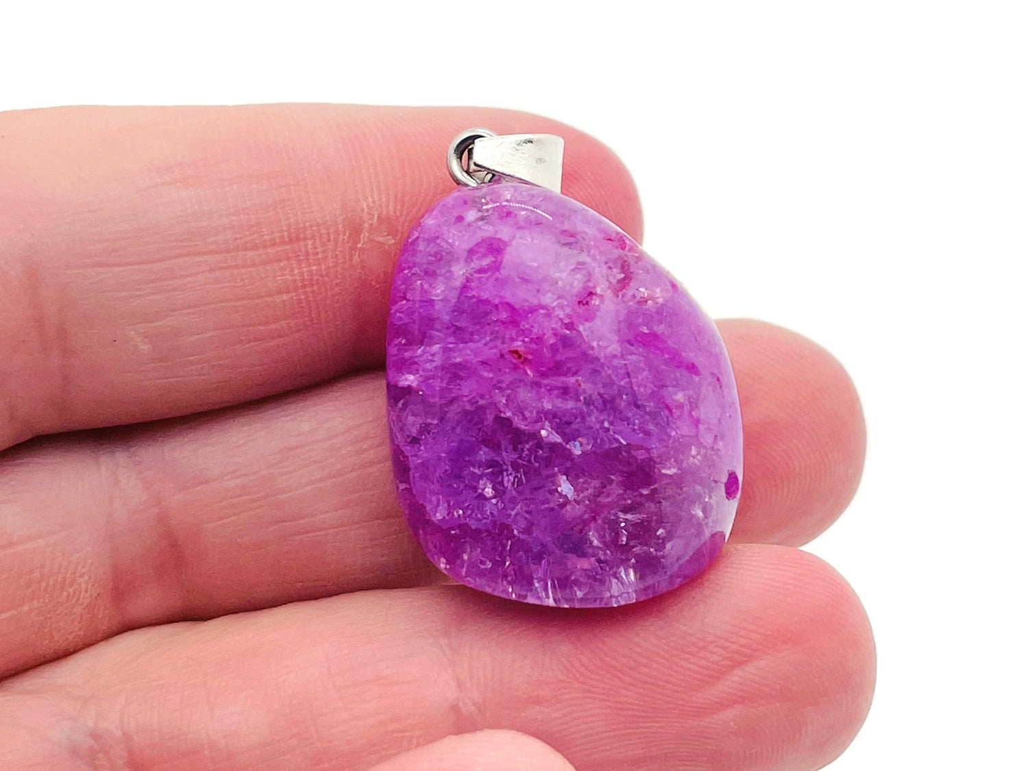 Lilac agate crystal pendant with silver setting, showcasing a polished loose stone ideal for Reiki and gemstone jewelry.
