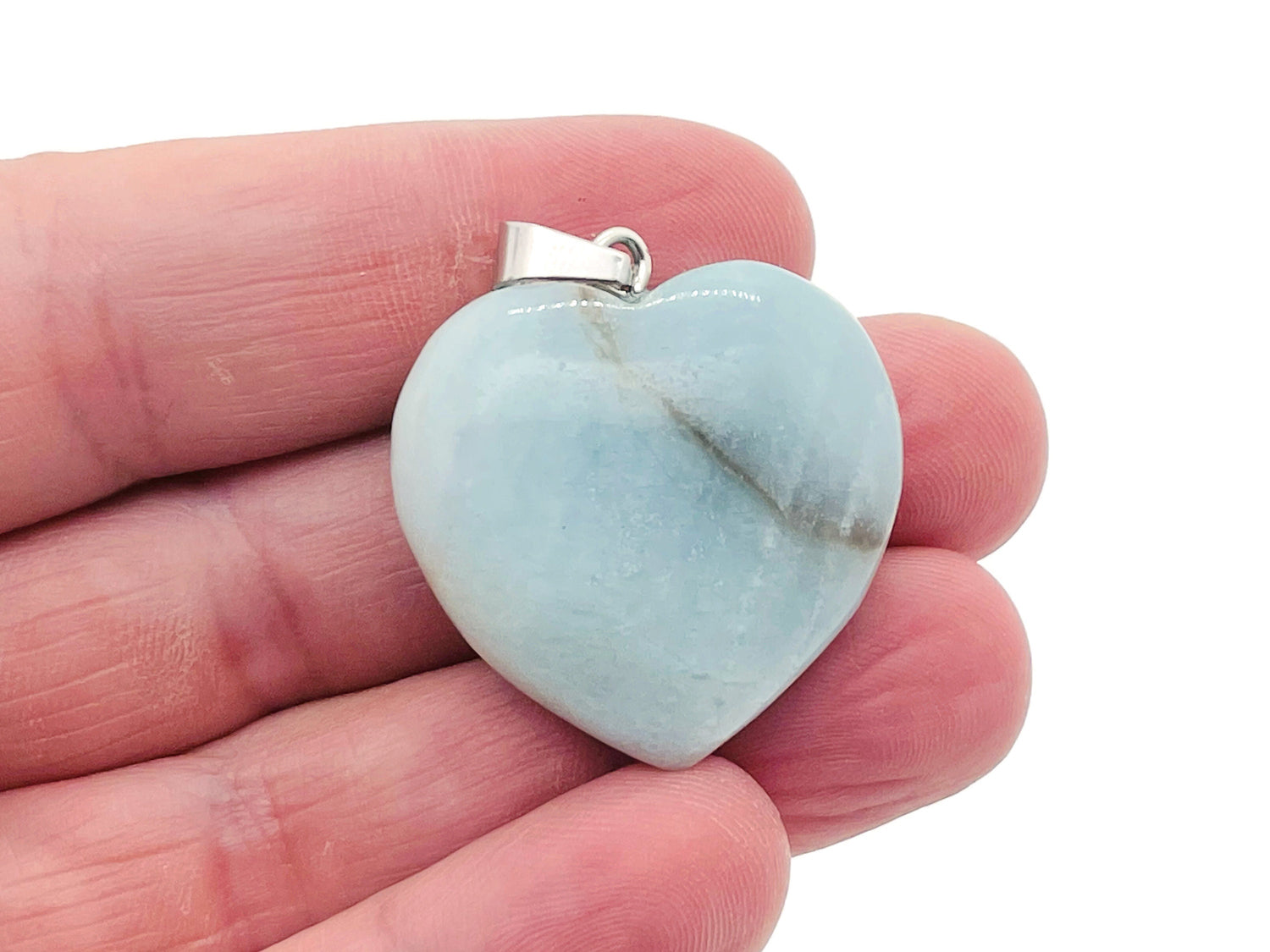 Amazonite heart crystal pendant from GemstoneGO, featuring a polished reiki gemstone with a silver bail on a black cord.