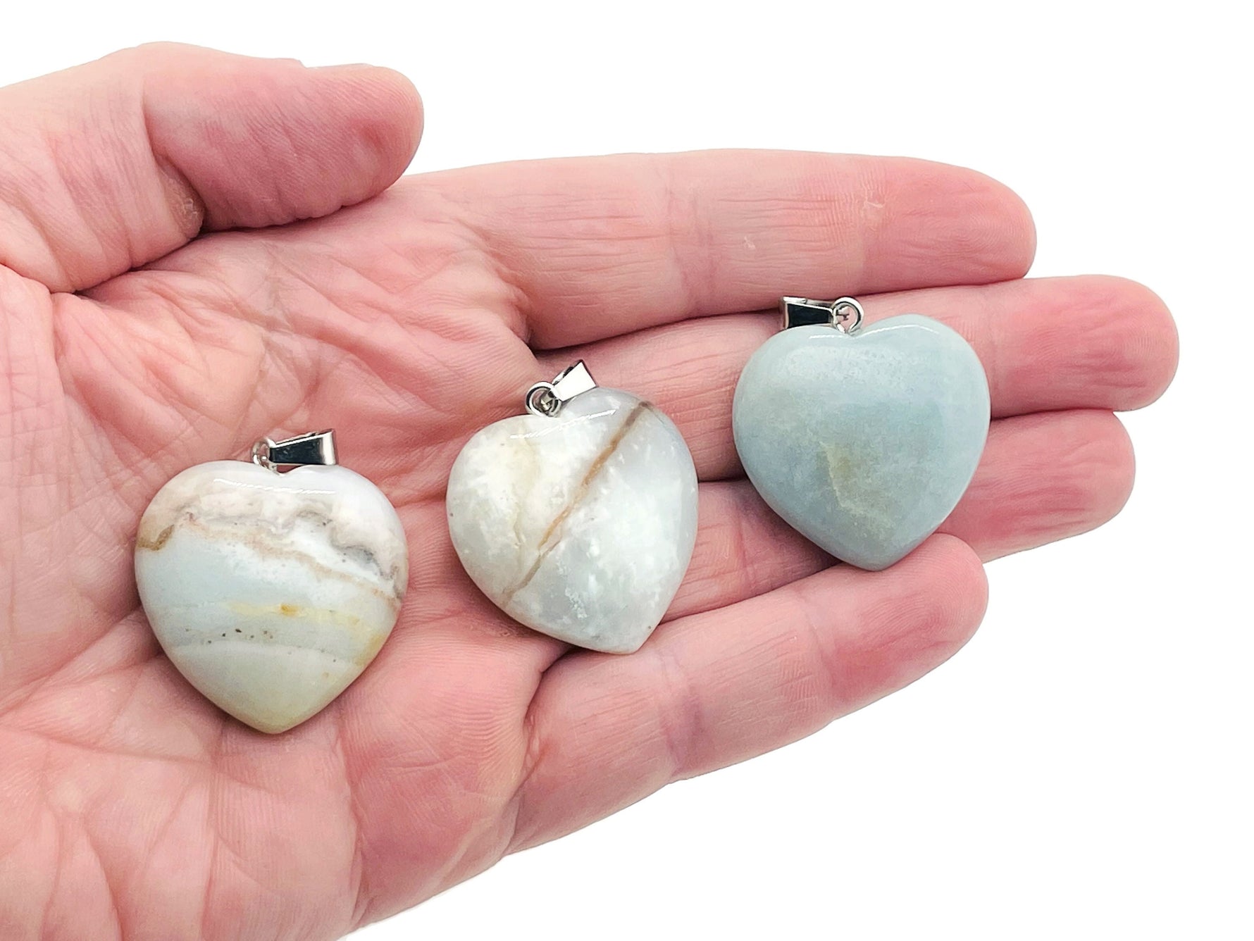 Amazonite heart-shaped crystal pendant from GemstoneGO, featuring a Reiki crystal design, showcasing the smooth, polished gemstone.