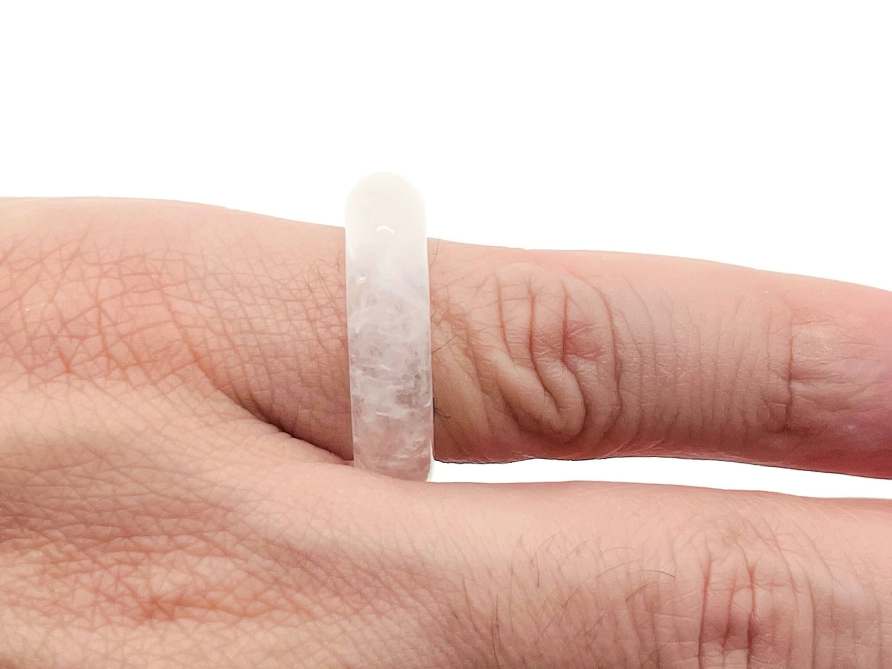 Clear Quartz crystal ring by GemstoneGO featuring a large, polished quartz stone set in a silver band.