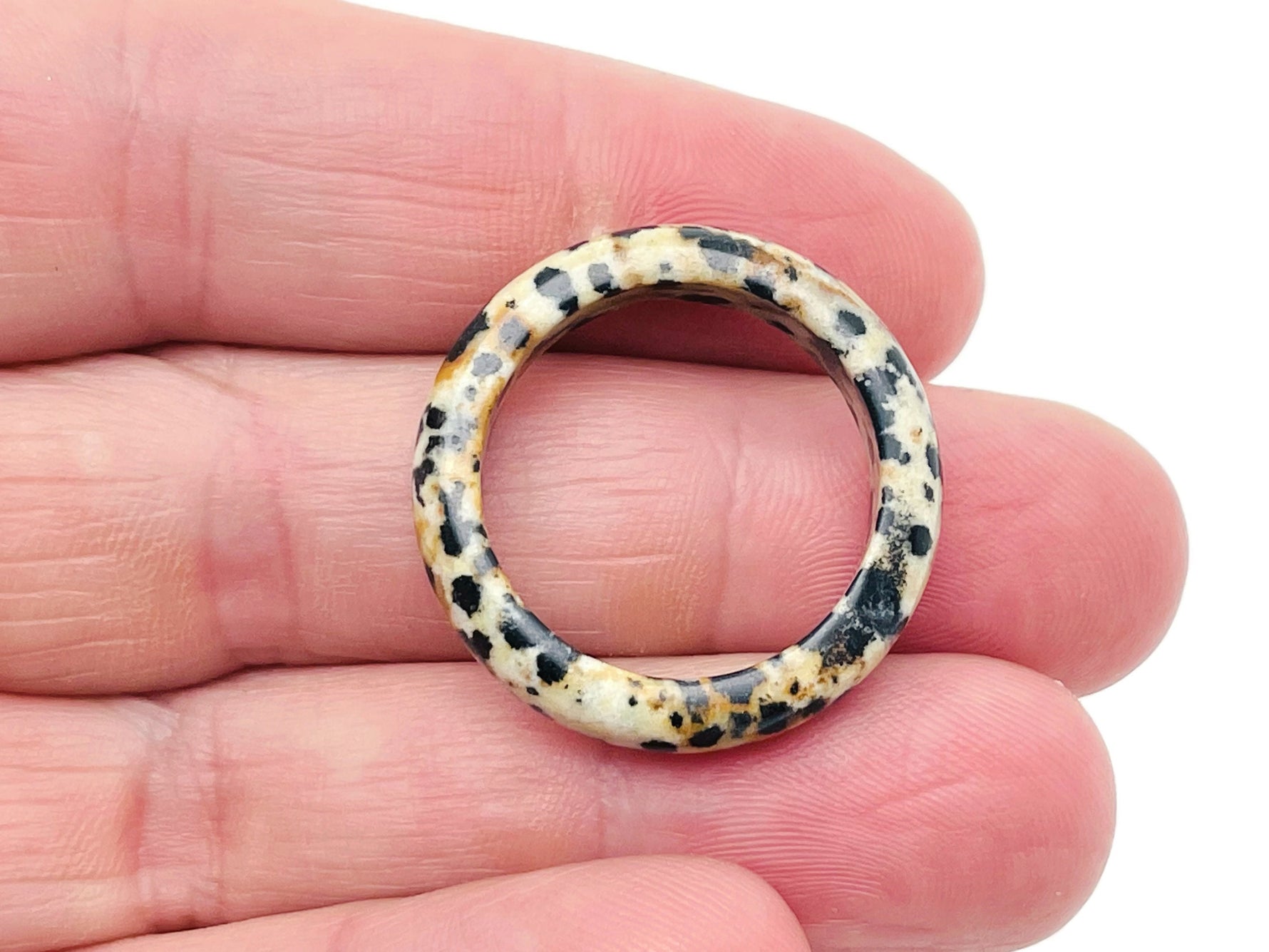 Dalmatian Jasper Crystal Ring by GemstoneGO featuring a round black and white patterned stone set in a silver band.