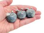 Labradorite Apple crystal carving from GemstoneGO, 30mm polished gemstone with iridescent labradorite flash and detailed apple shape.